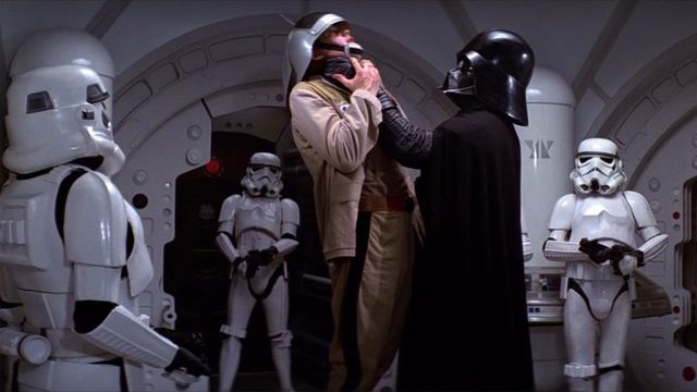 Darth Vader
choking a rebel soldier
as storm troopers watch