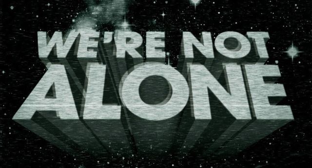 We're Not Alone (in big block letters, in space)