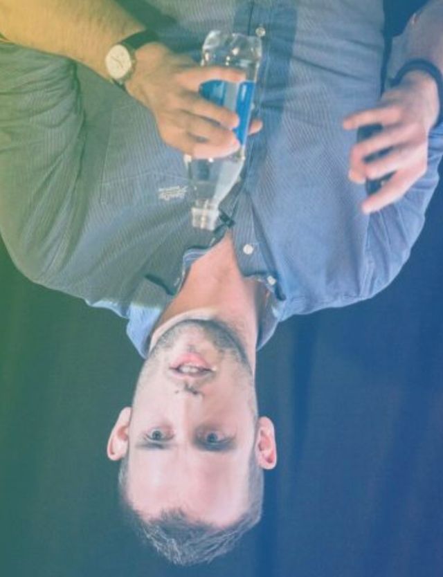 Upside-down headshot of Harry Roberts.